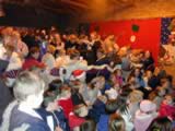 Enjoying the festive cheer inside the Community Centre (110kb)