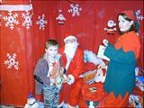 Santa gives a boy a present